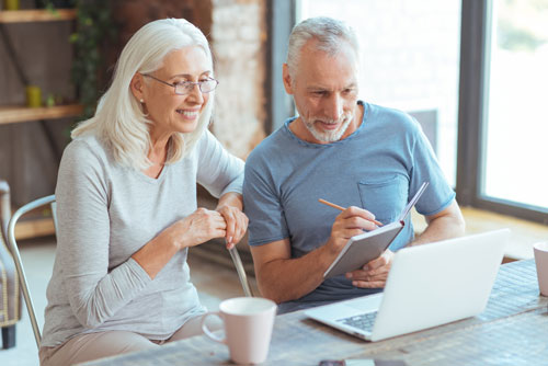 Couple studying higher MYGA interest rates from Phoenix