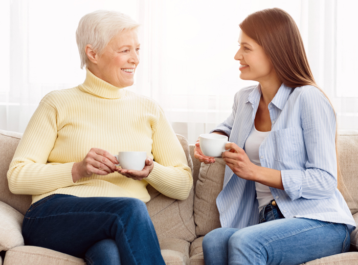 Mom and daughter drinking coffee